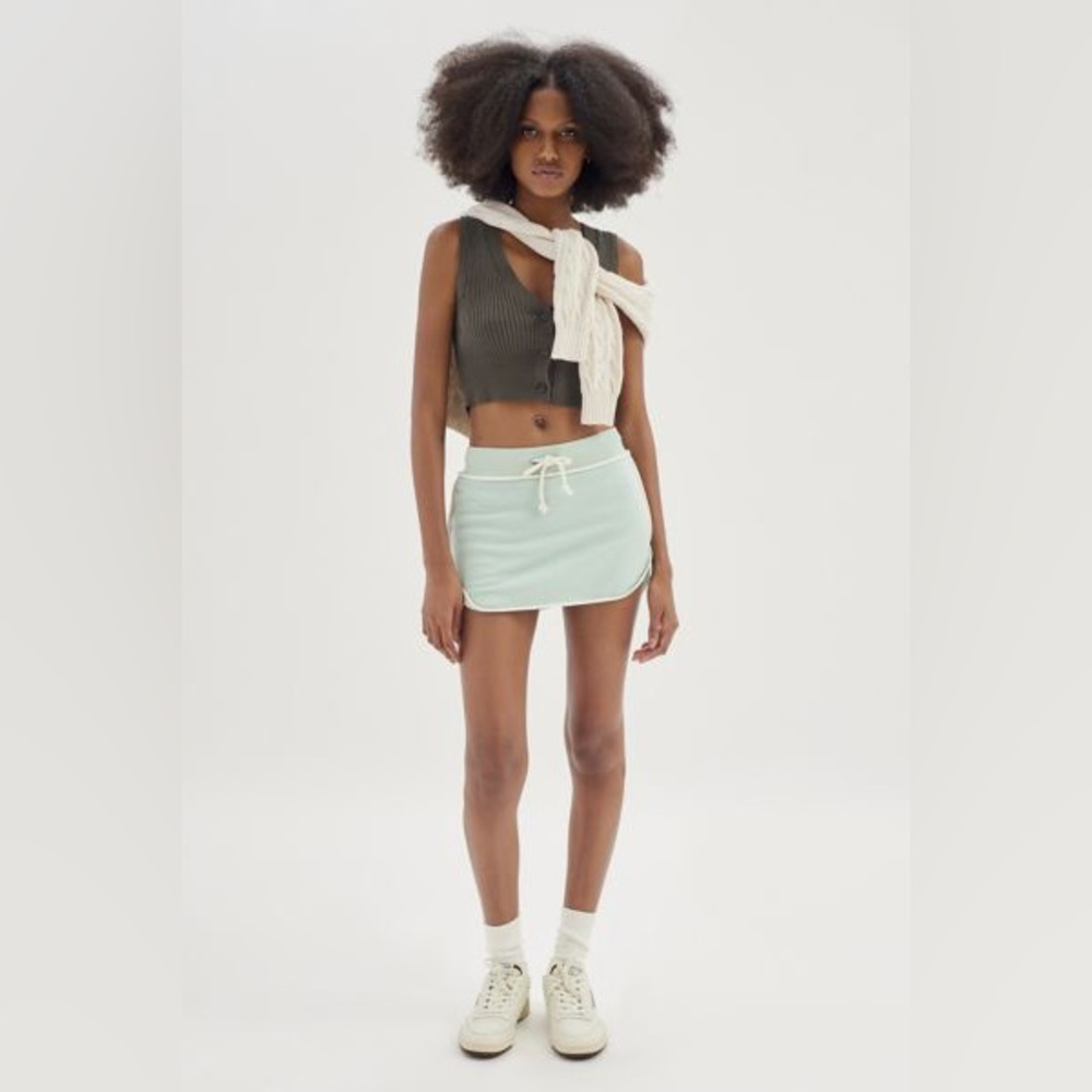 Out from under mini skirt. Worn once. Super cute and comfy! Shorts built in.